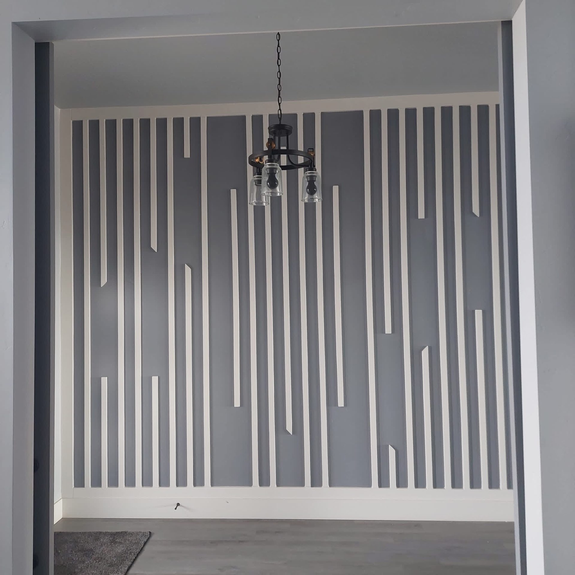 Vertical slat accent wall in entryway