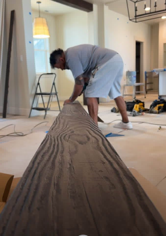 Master craftsman measuring custom trim