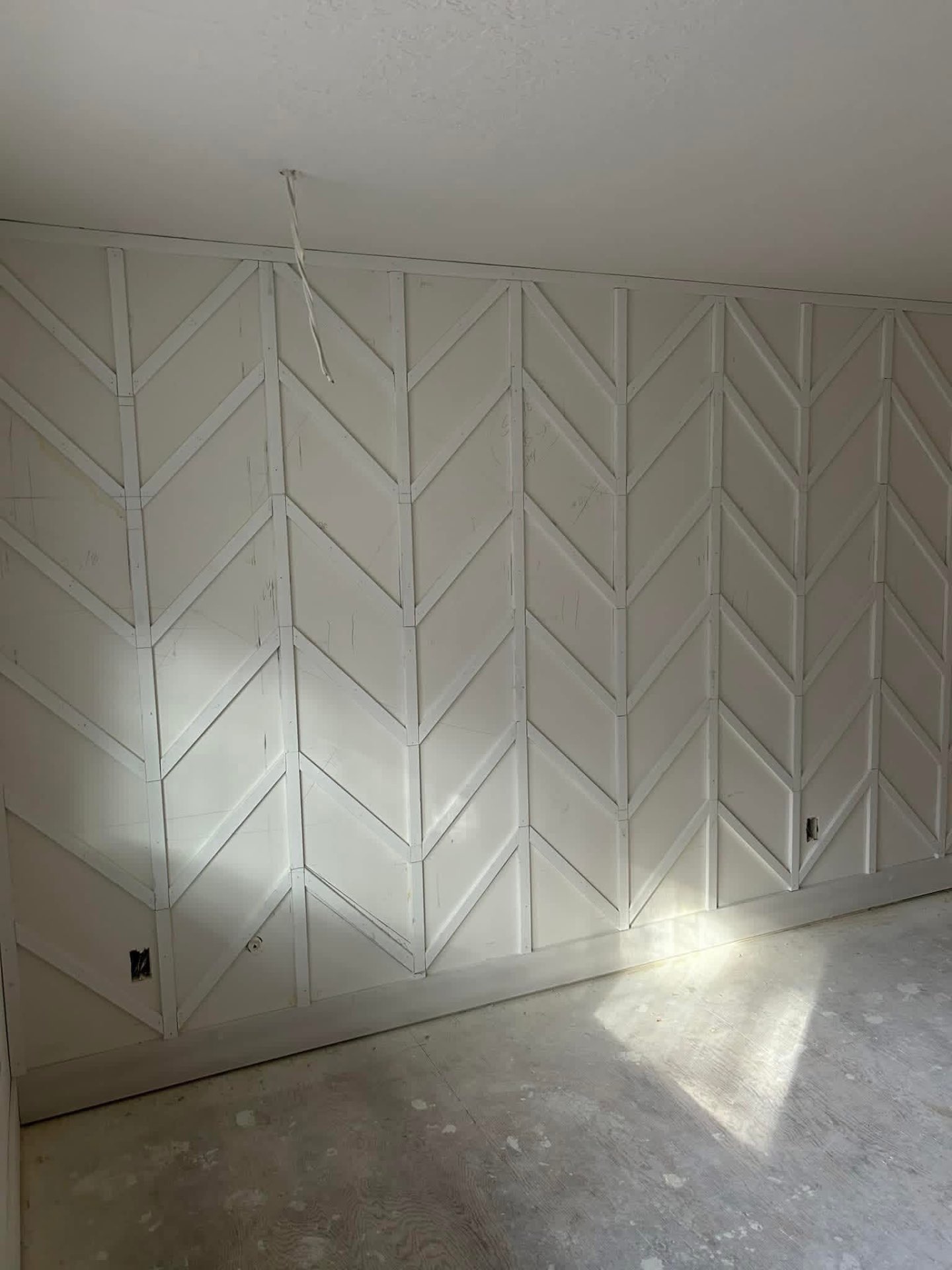 White chevron paneled accent wall